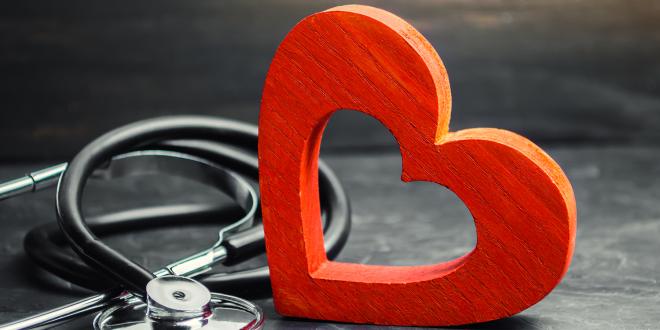 a wooden heart and a stethoscope