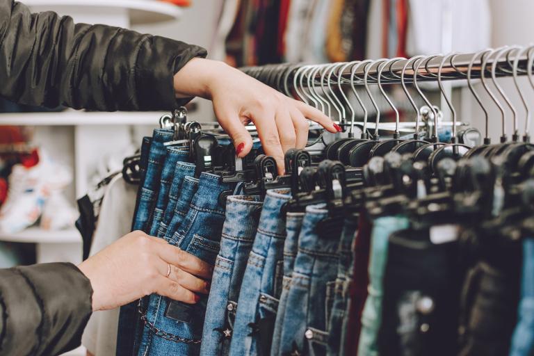 a woman shopping for jeans