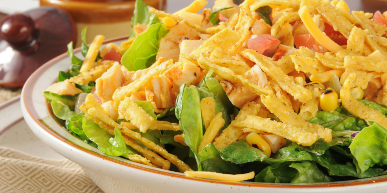 a plate of seasoned filling and tortilla strips